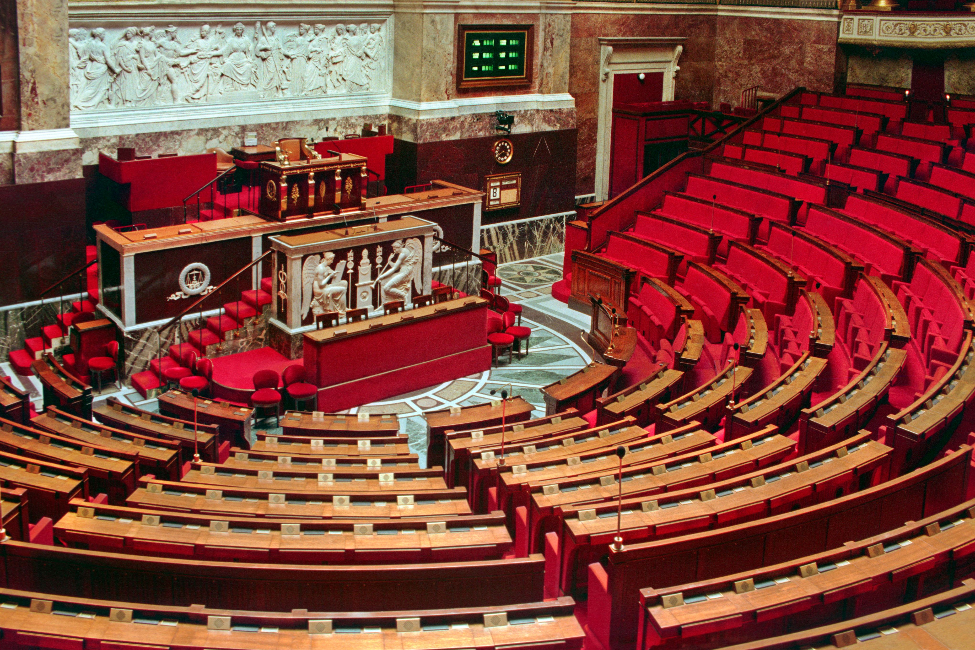 Interior of a national assembly legislative chamber where foreign policy and diplomacy are debated